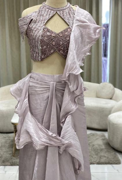 Mannequin wearing a lavender dress in a store setting